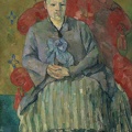 Polis Sezanas. Madam Cézanne raudoname fotelyje. Apie 1877 m.